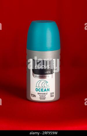 Salvador, Bahia, Brazil - July 30, 2023: Above men elements ocean brand deodorant, standing against a red background. Stock Photo