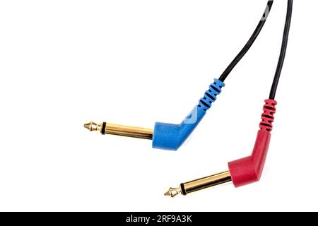 Two Headphones Jack on Black Background. Audio mini jack plug isolated. Stock Photo