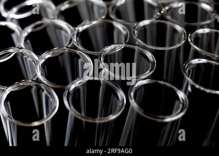 Close up of empty test tubes on black background. Stock Photo