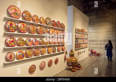 Dhaka. 1st Aug, 2023. A visitor views artworks displayed at an exhibition titled 'Folk Art of Bangladesh: Illustrated Pottery' in Dhaka, Bangladesh, on Aug. 1, 2023. Credit: Xinhua/Alamy Live News Stock Photo