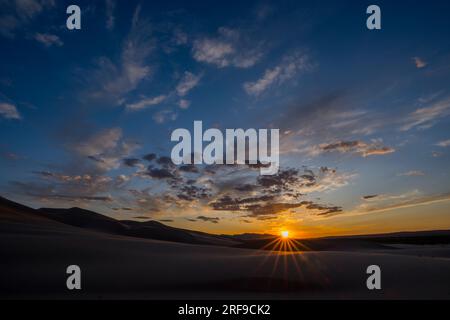 Sunset over the Hongoryn Els sand dunes in the Gobi Desert in southern Mongolia. Stock Photo