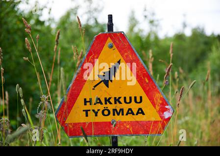 Nokia, Finland - July 31, 2023:  Woodworking site warning sign and on sunny July evening in Western Finland. Stock Photo