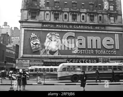 New York, New York:  February, 1943 The smoking Camel cigarette advertisement billboard at 44th St and Broadway in Times Square . Smoke would puff out of the model's mouth. Stock Photo