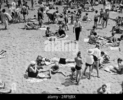 New York, New York:  July, 1938 Bathers on the sands at Coney Island in Brooklyn. Stock Photo