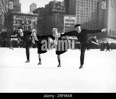 New York, New York:  c. 1952 Showing their considerable skill and balance, two pairs of skaters pose for the camera while ice skating in New York's Central Park. Stock Photo