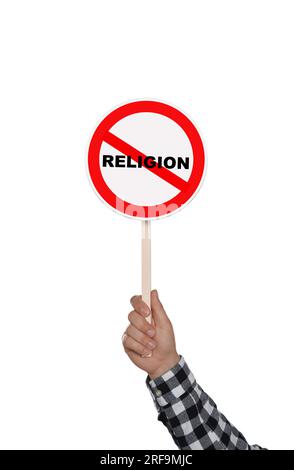 Atheism concept. Man holding prohibition sign with crossed out word Religion on white background Stock Photo