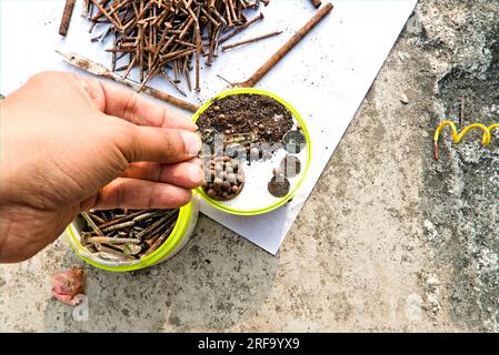old rusted brown colored iron pieces and dust Stock Photo
