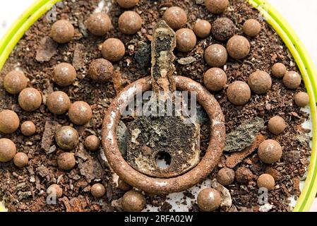 old rusted brown colored iron pieces and dust Stock Photo