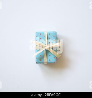 Sky blue dot pattern gift box isolated on white background. top view, copy space Stock Photo