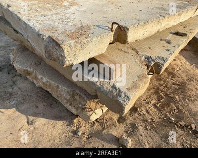 Reinforced concrete with damaged and rusty metal fittings. hollow reinforced concrete slab with reinforcement. Stock Photo