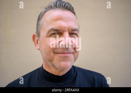 Close up of an attractive man smiling to the camera Stock Photo