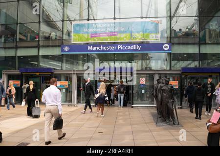 Manchester Piccadilly train station entrance with commuters. UK Stock Photo