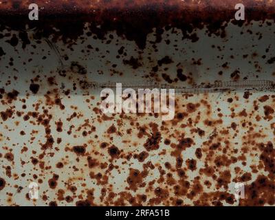 Rusty surface with exfoliated paint in beige using as background Stock Photo