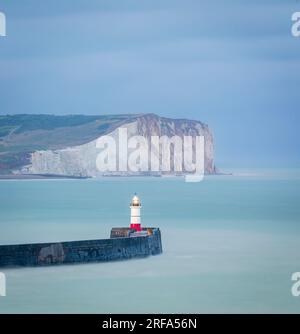 View of Newhaven lighthouse and seaford head from castle hill cliffs on the east Sussex coast south east England UK Stock Photo