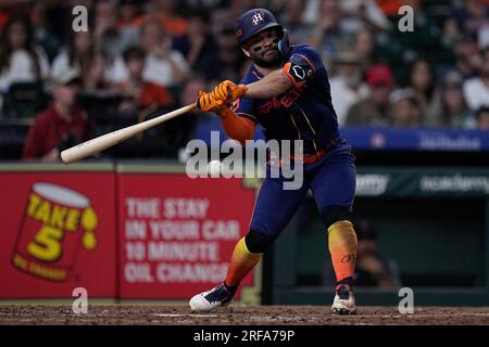 Cleveland Guardians starting pitcher Noah Syndergaard, right, talks with  head athletic trainer James Quinlan, left, after being hit by a comebacker  from Houston Astros' Jeremy Pena during the sixth inning of a