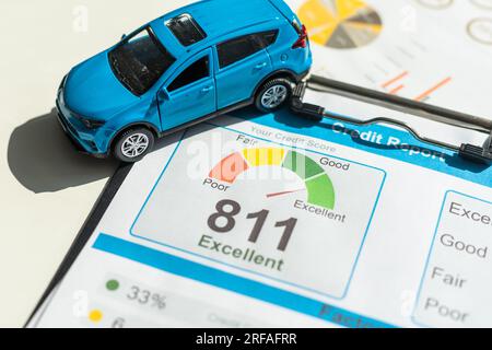 Toy car, documents and calculator on table. Car insurance concept Stock Photo