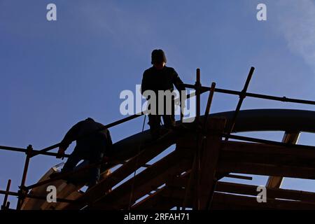 worker in the construction site making reinforcement metal framework for concrete pouring Stock Photo