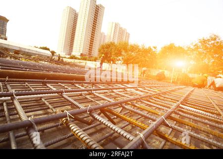 worker in the construction site making reinforcement metal framework for concrete pouring Stock Photo