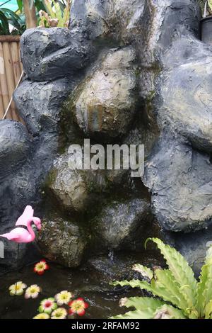 Small Artificial Rock Waterfalls on waterfall park Stock Photo