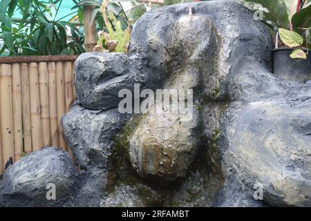 Small Artificial Rock Waterfalls on waterfall park Stock Photo