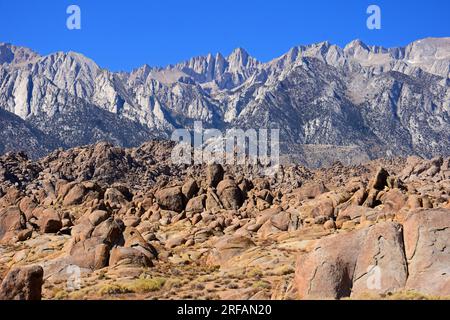 mount whitney, the eastern sierras, and the wildly eroded rock formations of the alabama hills on a sunny fall day, near lone pine, california Stock Photo