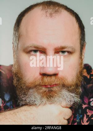 Portrait of attractive cheerful intelligent grey-haired woman granny