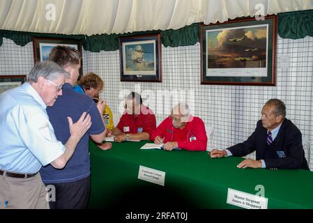 Meet & signing event for Tuskegee Airmen, black American Air Force Second World War pilots & crew. Wheller (l), Howard Baugh (c), James A Sheppard (r) Stock Photo