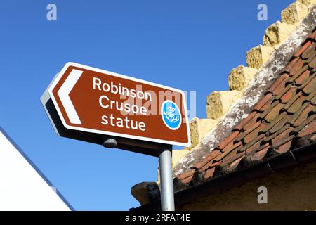 Sign showing the direction to the Robinson Crusoe statue in Scotland, in the Fife town of Lower Largo. Stock Photo