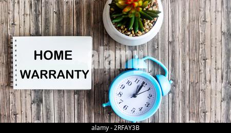 Home Warranty shown in photo with text on notepad Stock Photo