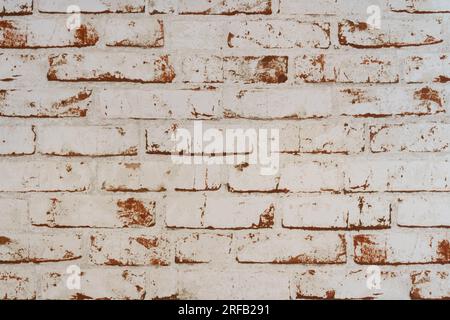 Whitewashed red brick wall. Texture of a brick wall. Stock Photo