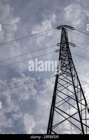 High voltage pole in the city park Stock Photo
