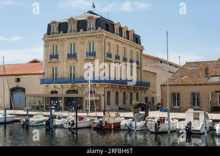 View of Port de Marseillan with moored pleasure boats along quayside, Herault, Occitanie, France Stock Photo