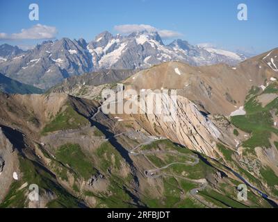 AERIAL VIEW. Col du Galibier (2642m) with the Meije (3984m) for a majestic background. Between Le Monêtier-les-Bains and Valloire. France. Stock Photo