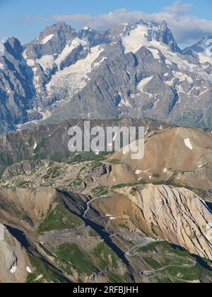 AERIAL VIEW. Col du Galibier (2642m) with the Meije (3984m) for a majestic background. Between Le Monêtier-les-Bains and Valloire. France. Stock Photo