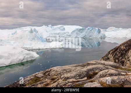 scenic landscape of ilulissat icefjord UNESCO site filled with huge icebergs calved from the most productive glacier in the north Stock Photo