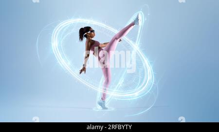 Black woman training self-defence, using VR headset Stock Photo
