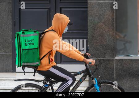 Uber Eats, an American online food ordering and delivery service; cyclist in Fishergate, Preston, Lancashire, UK Stock Photo