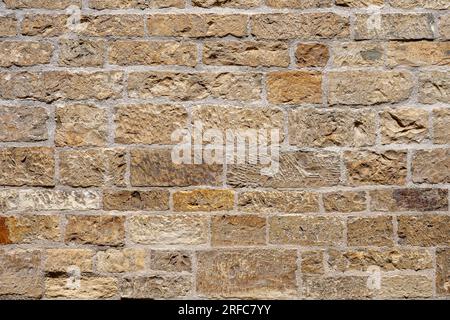 Background from a brown wall made of natural stone Stock Photo