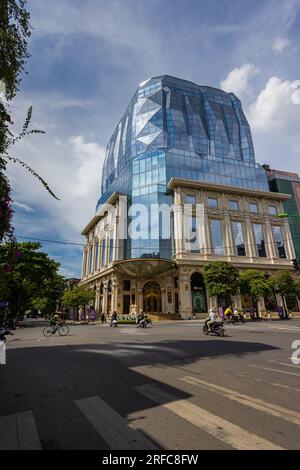 Hanoi, Vietnam - May 28, 2023: Doji Tower soars against the skyline, its sleek modern design a juxtaposition to Hanoi's traditional architecture. Its Stock Photo