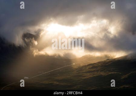 Striking light and clouds at sunset at the Pass of Glencoe from Beinn a' Chrulaiste , Scotland Stock Photo