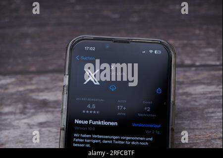 Mainz, Germany - August 02, 2023: icon of the twitter app with the new X logo on a German smartphone Stock Photo