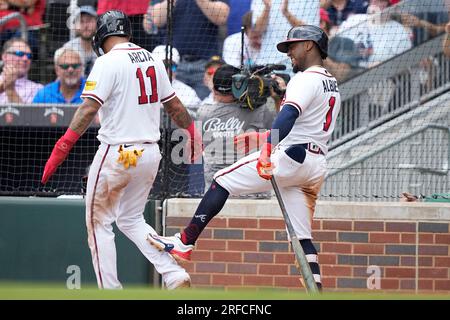 Atlanta Braves shortstop Dansby Swanson and second baseman Orlando Arcia  (11) celebrate the team's win over the St. Louis Cardinals in a baseball  game Wednesday, July 6, 2022, in Atlanta. (AP Photo/Edward