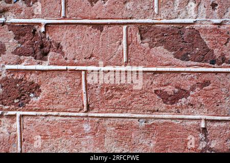 background red wall bricks with cement closeup. Horizontal photo Stock Photo