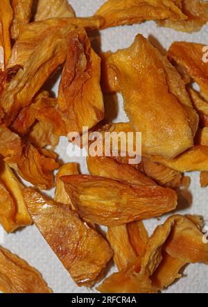 Sun dried pineapple slices pieces of small fruits on white background close up botanical healthy eating concept big size high quality instant stock ph Stock Photo