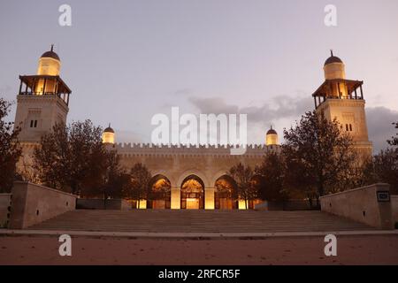 Beautiful Islamic golden mosque with four minarets in Amman, Jordan (King Hussein Bin Talal Mosque) in autumn at evening Stock Photo