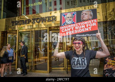 In the wake of the latest Special Counsel Jack Smith's indictement of Donald Trump, members of the activist group Rise and Resist and allies gathered outside Trump Tower in Manhattan on August 2, 2023 demanding state governments to disqualify former President Trump from appearing on ballots in 2024 under the 14th Amendment. The group stated that secretaries of state are empowered by the 14th Amendment to bar Trump from running for office because of his incitement of the January 6, 2021 Capitol insurrection. (Photo by Erik McGregor/Sipa USA) Stock Photo