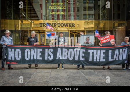 In the wake of the latest Special Counsel Jack Smith's indictement of Donald Trump, members of the activist group Rise and Resist and allies gathered outside Trump Tower in Manhattan on August 2, 2023 demanding state governments to disqualify former President Trump from appearing on ballots in 2024 under the 14th Amendment. The group stated that secretaries of state are empowered by the 14th Amendment to bar Trump from running for office because of his incitement of the January 6, 2021 Capitol insurrection. (Photo by Erik McGregor/Sipa USA) Stock Photo