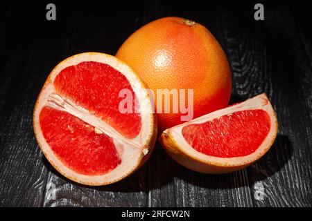 sliced grapefruit on wood background Stock Photo