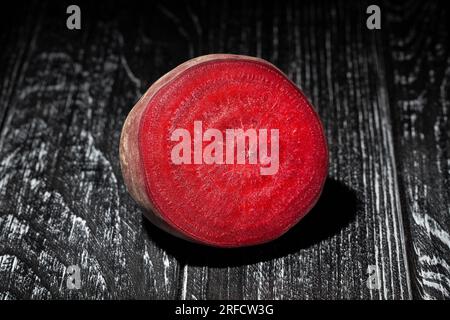 sliced beetroot on wood background Stock Photo