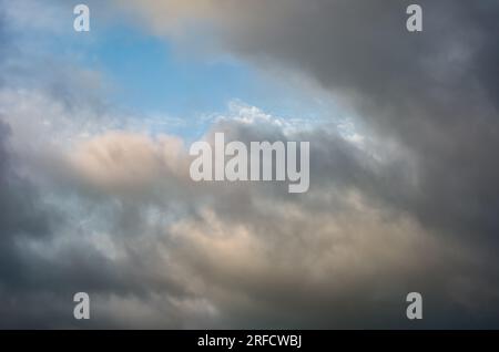 Layers of fast moving clouds on a humid summer evening. Stock Photo